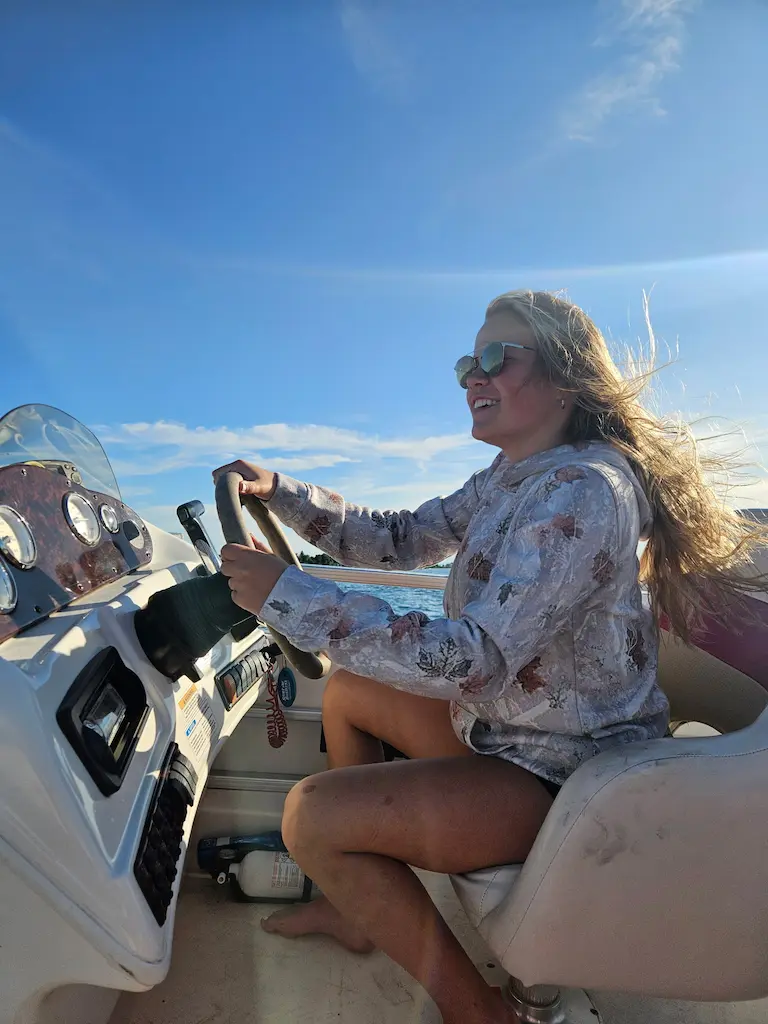Girl Driving Boat